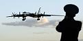 A Russian officer takes a picture of a Tu-95 bomber, or “Bear,” at a military airbase in Engels, some 900 km (559 miles) south of Moscow, August 7, 2008. Sergei Karpukhin/Reuters